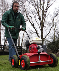 Lawn being scarified autumn spring