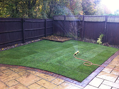 fresh green turf laid with patio
